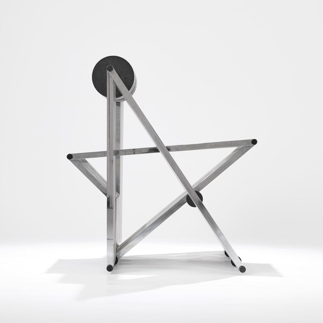 A minimalist metal sculpture with geometric lines