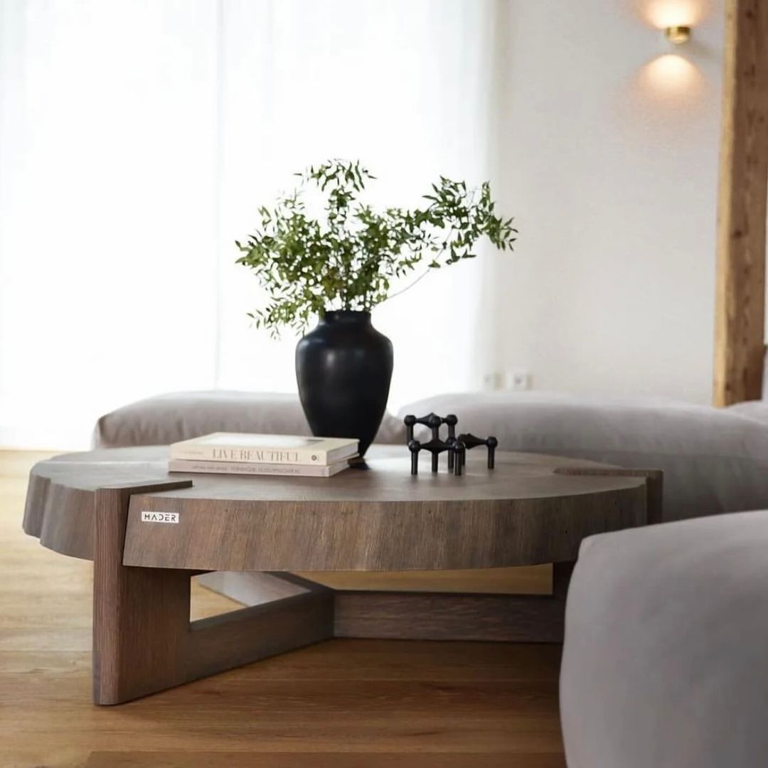 Modern minimalist living room with a sleek round coffee table