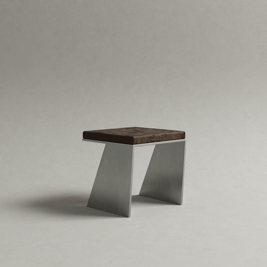 A minimalist stool with a dark wooden seat and angular metal legs