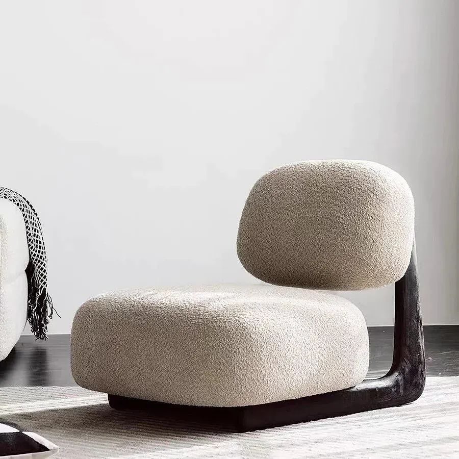 A stylish and contemporary chair with a unique blend of textures and strong geometric lines