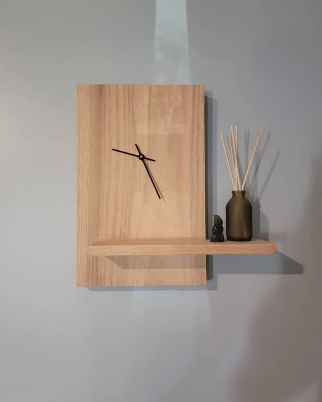 Minimalist wooden wall clock with a matching shelf