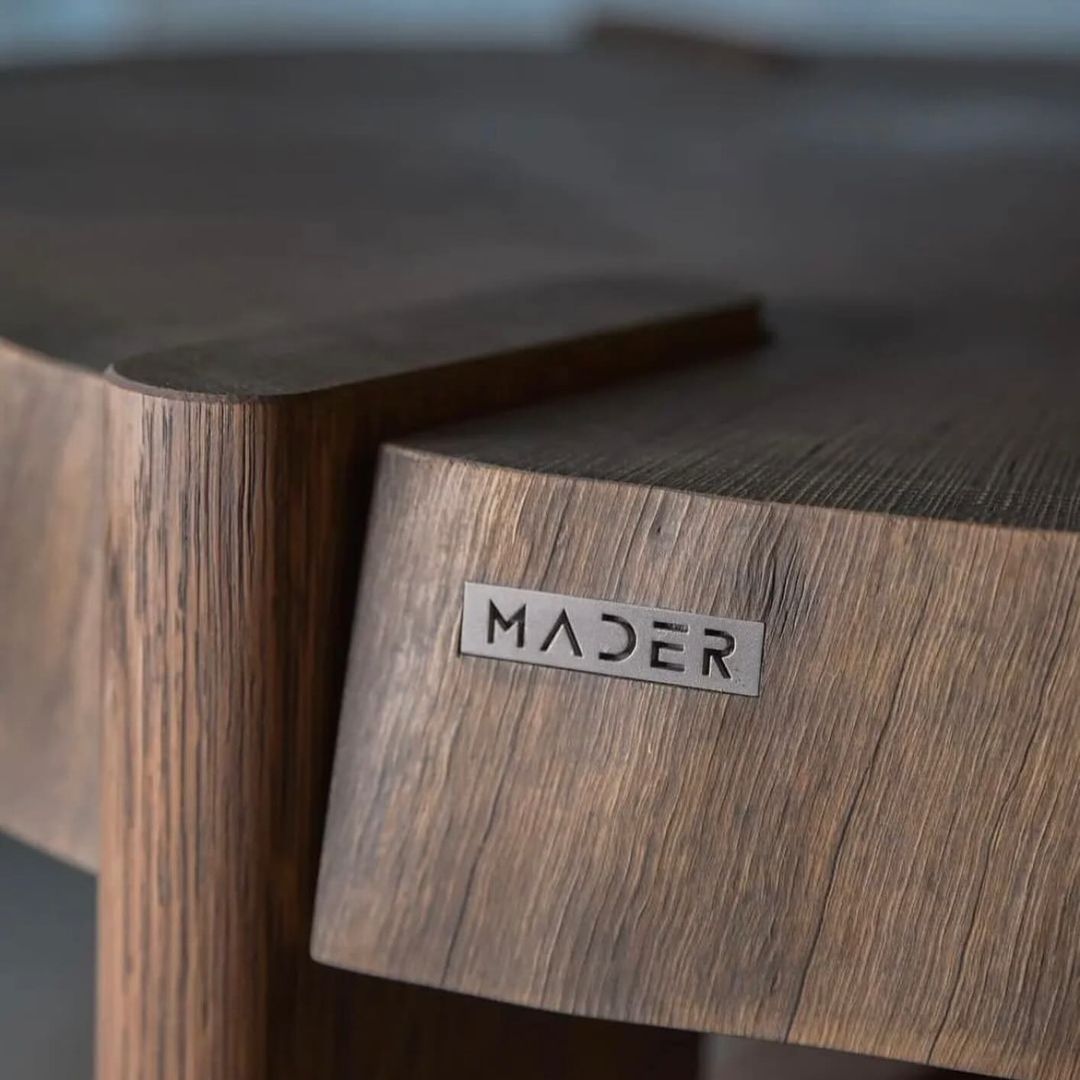 Close-up of the wood texture and branding on a piece of modern furniture