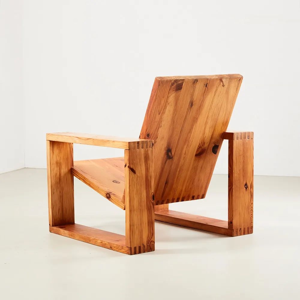 A modern wooden chair with a unique angular design