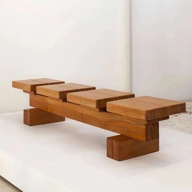 A unique wooden bench with staggered seats