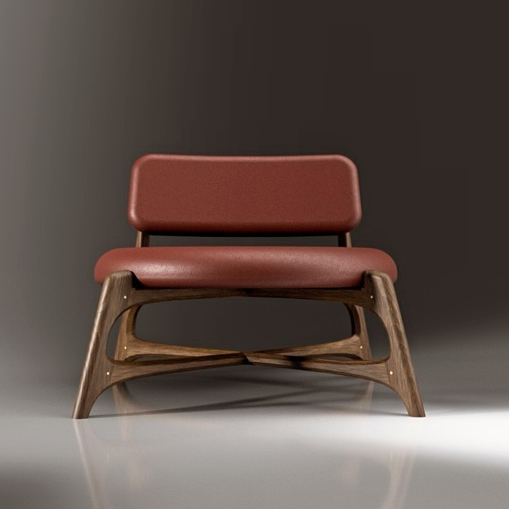 A stylish modern chair with a sleek wooden frame and red cushions