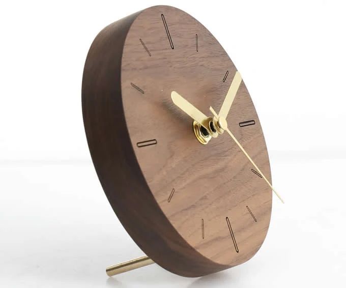 Modern wooden clock with gold hands