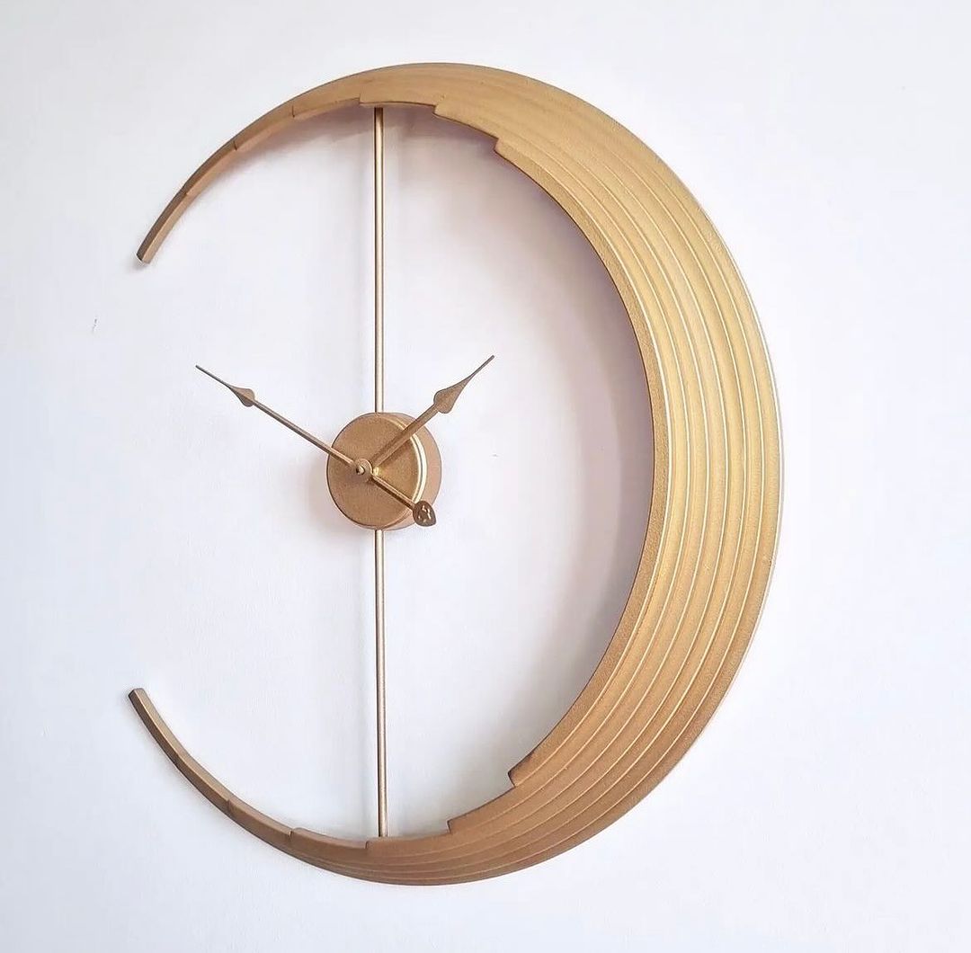 A unique wooden wall clock with a crescent shape