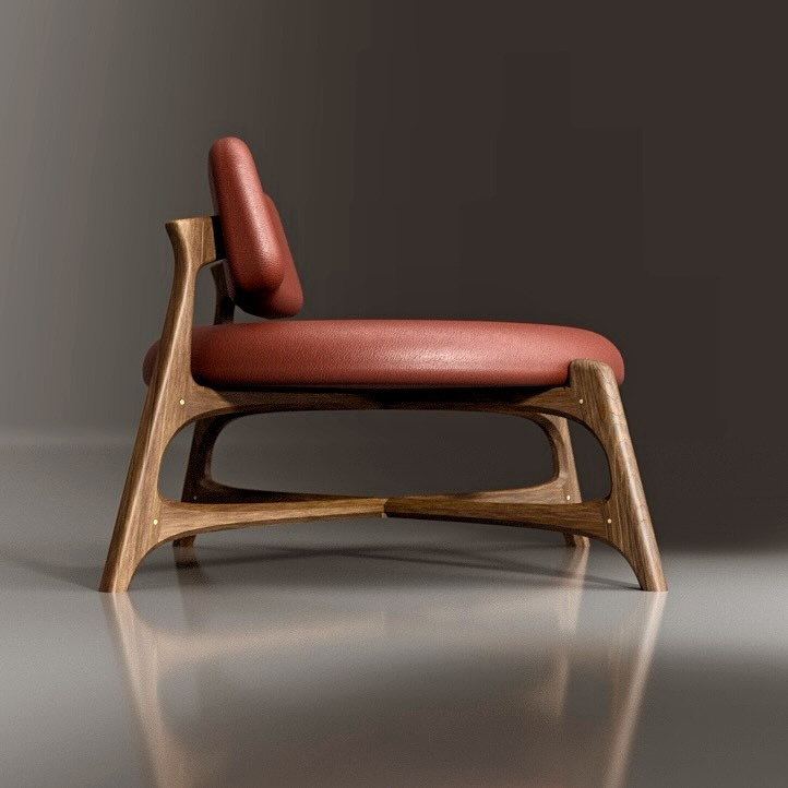 A modern wooden lounge chair with red leather upholstery