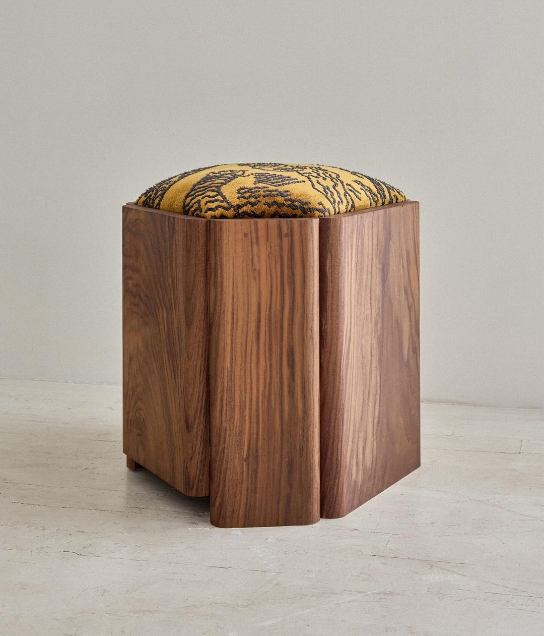 Stylish wooden stool with tiger pattern cushion