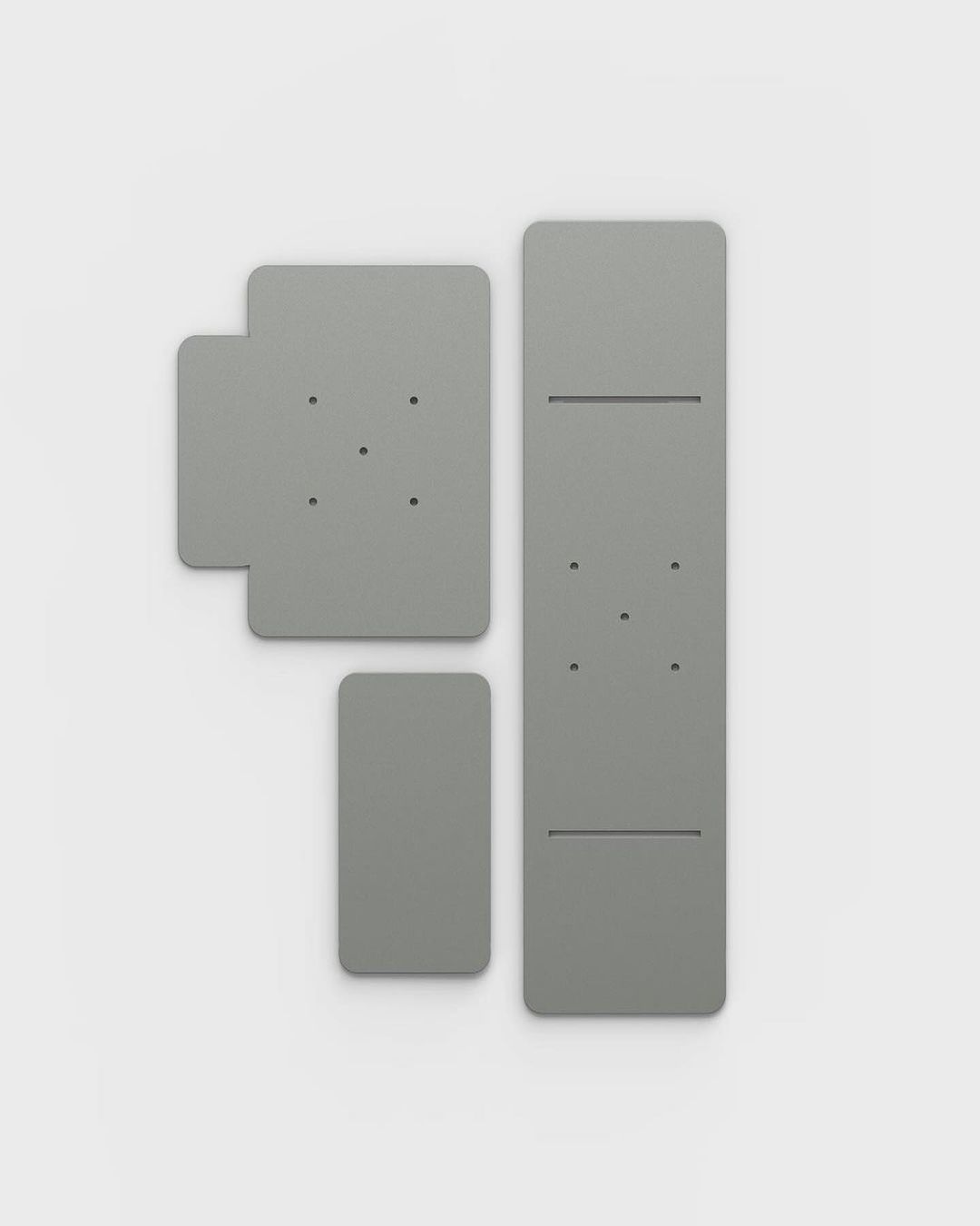 Various sizes of modular wall panels in grey