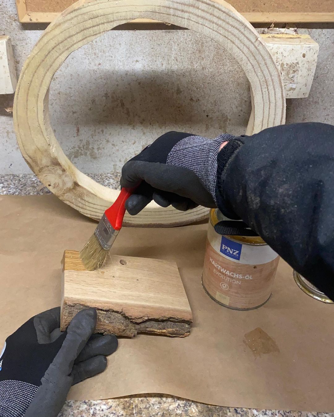 Applying finishing oil to a piece of wood