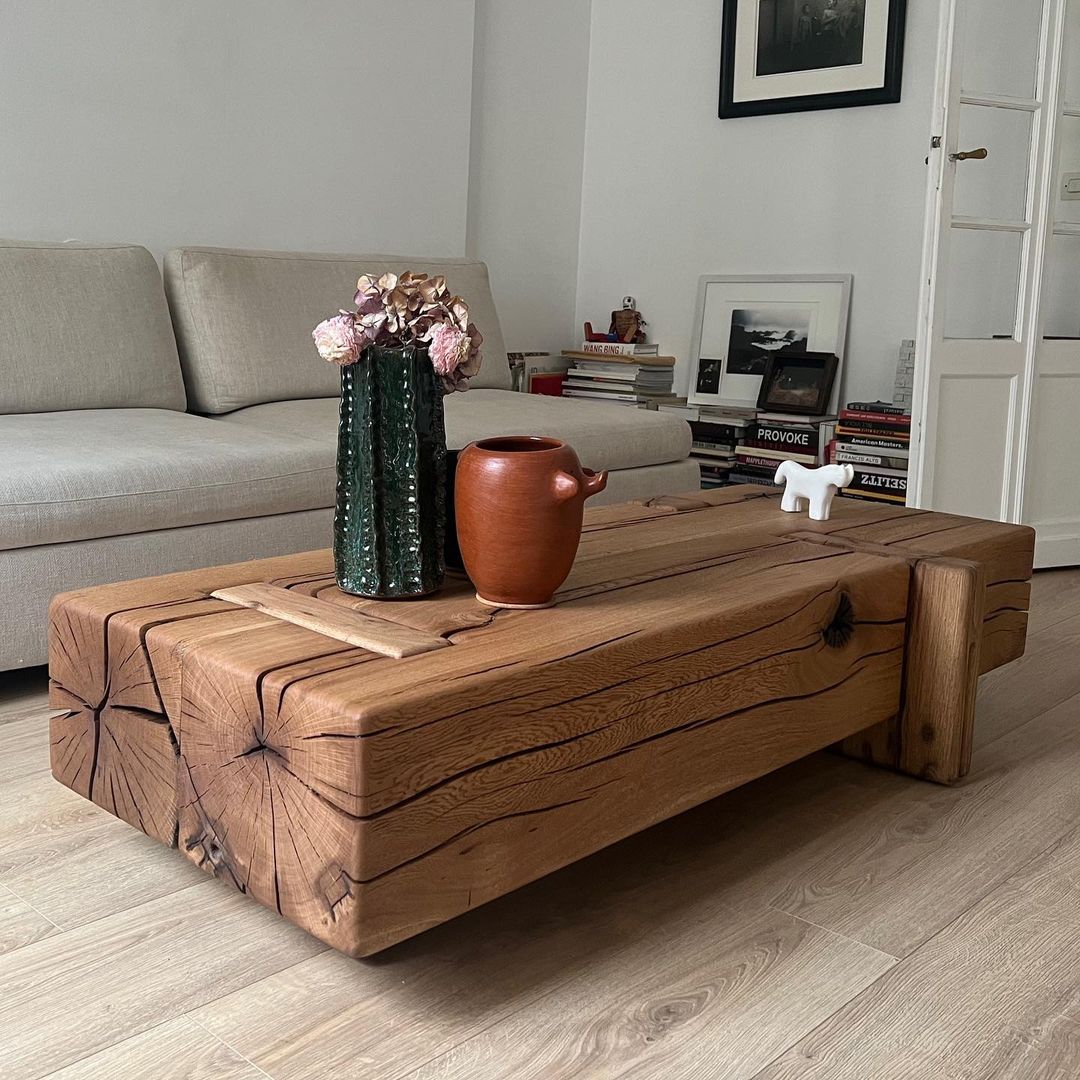 A modern living room featuring a robust wooden coffee table