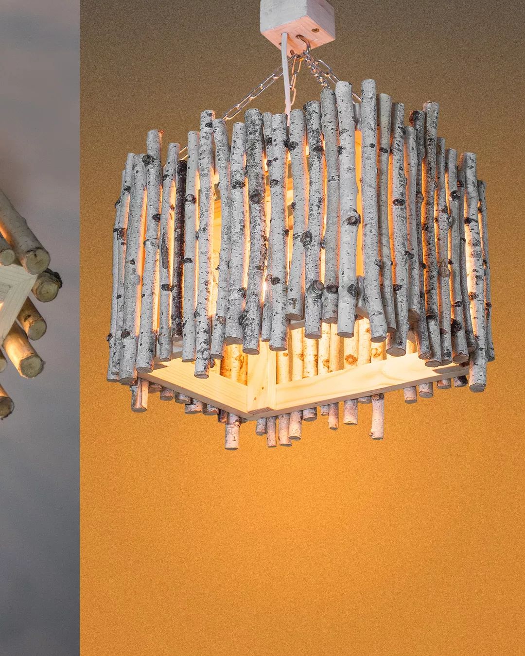 A unique chandelier crafted from birch logs and suspended by chains