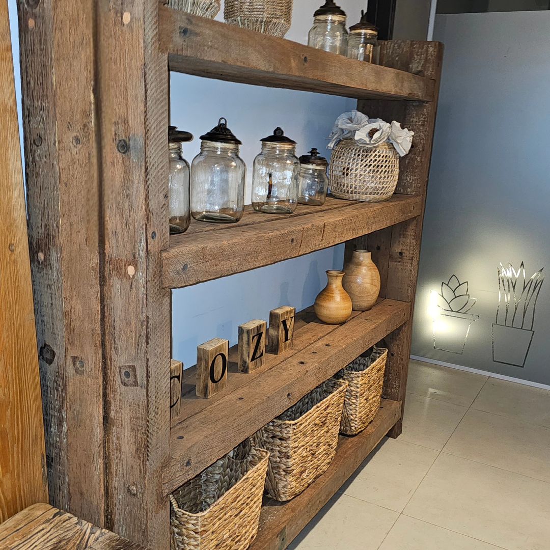 Rustic wooden shelving displaying home decor and storage baskets