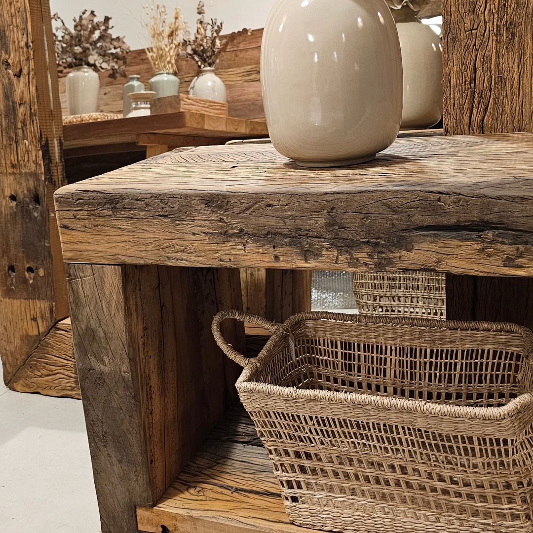 Rustic wooden console table with ceramic vase