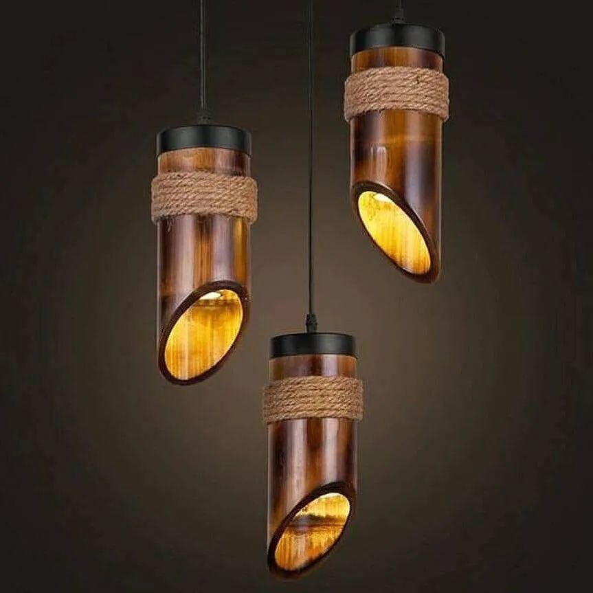 Set of three cylindrical pendant lights with a rustic design featuring wood and rope