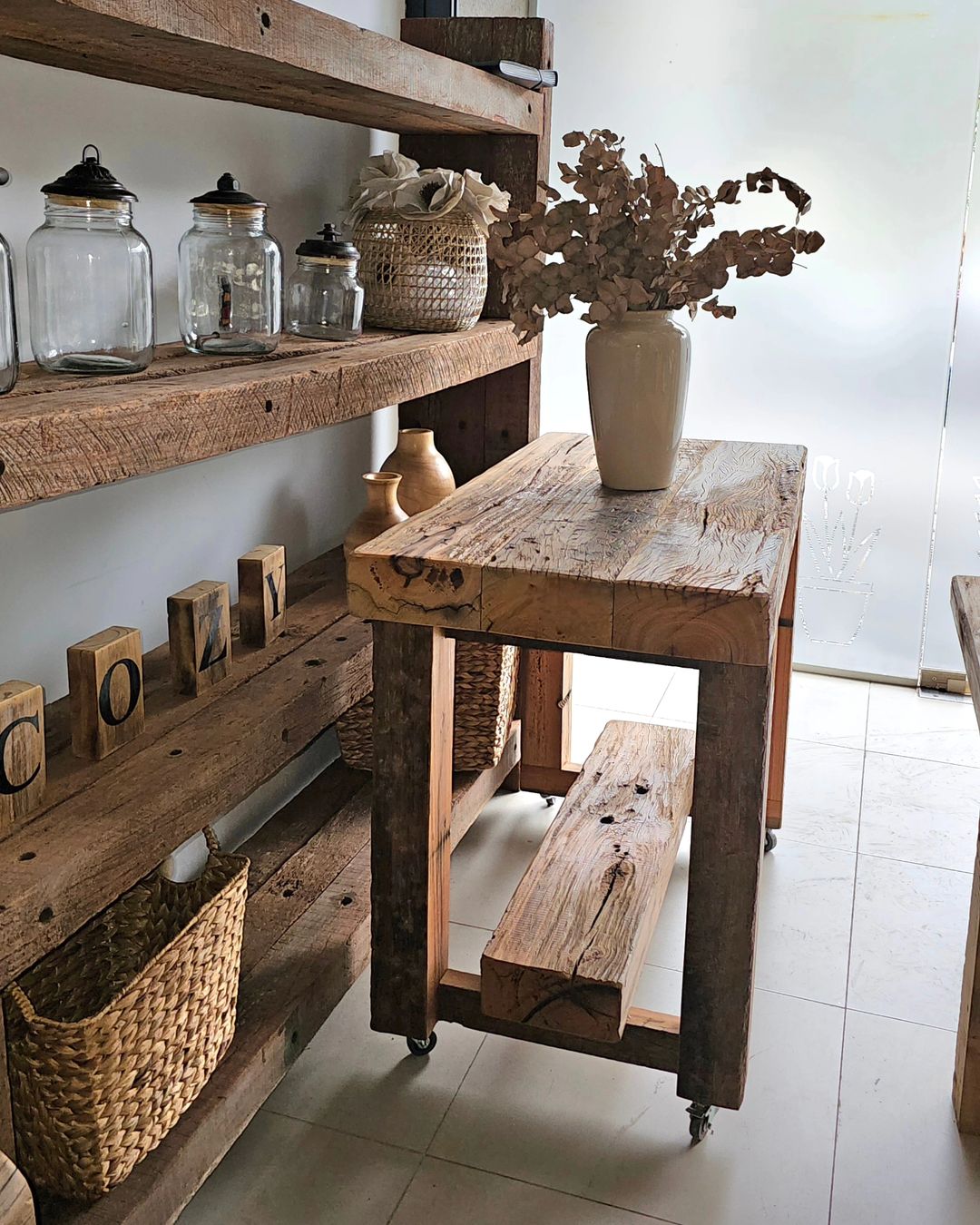 Rustic kitchen shelf and table setup with natural textures