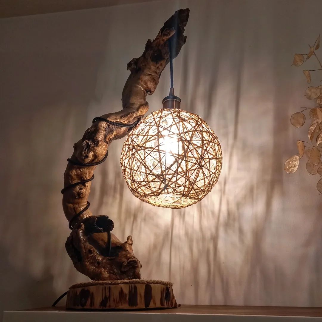 Rustic modern lamp with intertwined wood and spherical shade