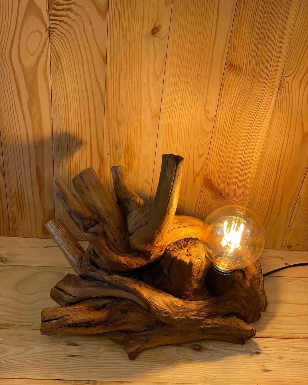 A unique table lamp crafted from gnarled wood