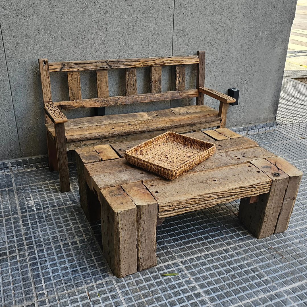 A rustic wooden bench with a woven tray