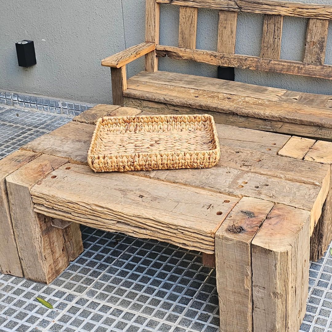 Rustic wooden bench with a woven tray