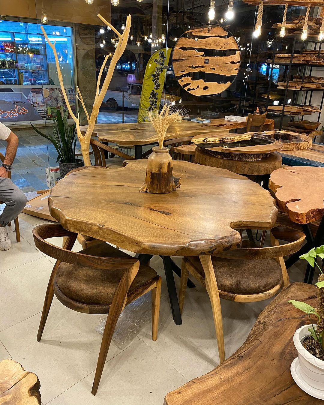 A rustic wooden dining set with unique live-edge table and matching chairs