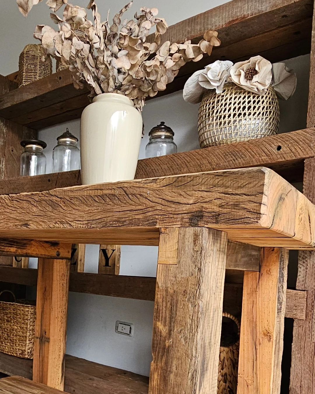 Rustic wooden shelf with decorative items