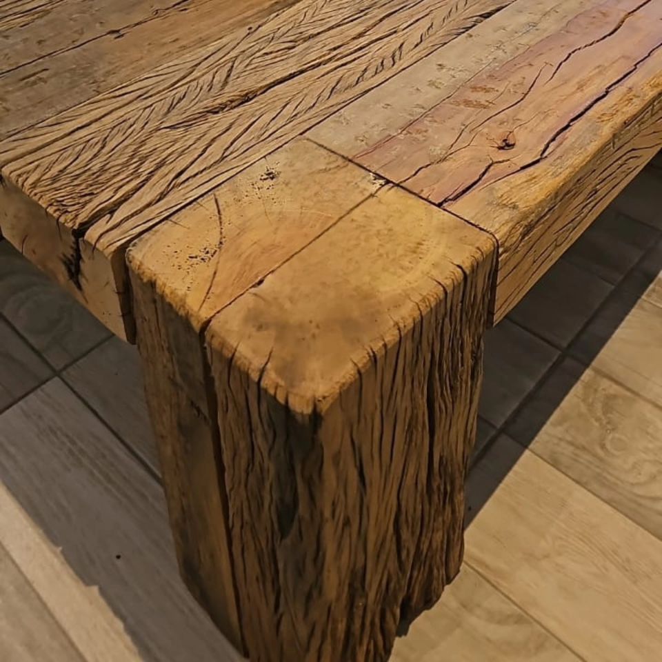 A rustic wooden table with textured grain