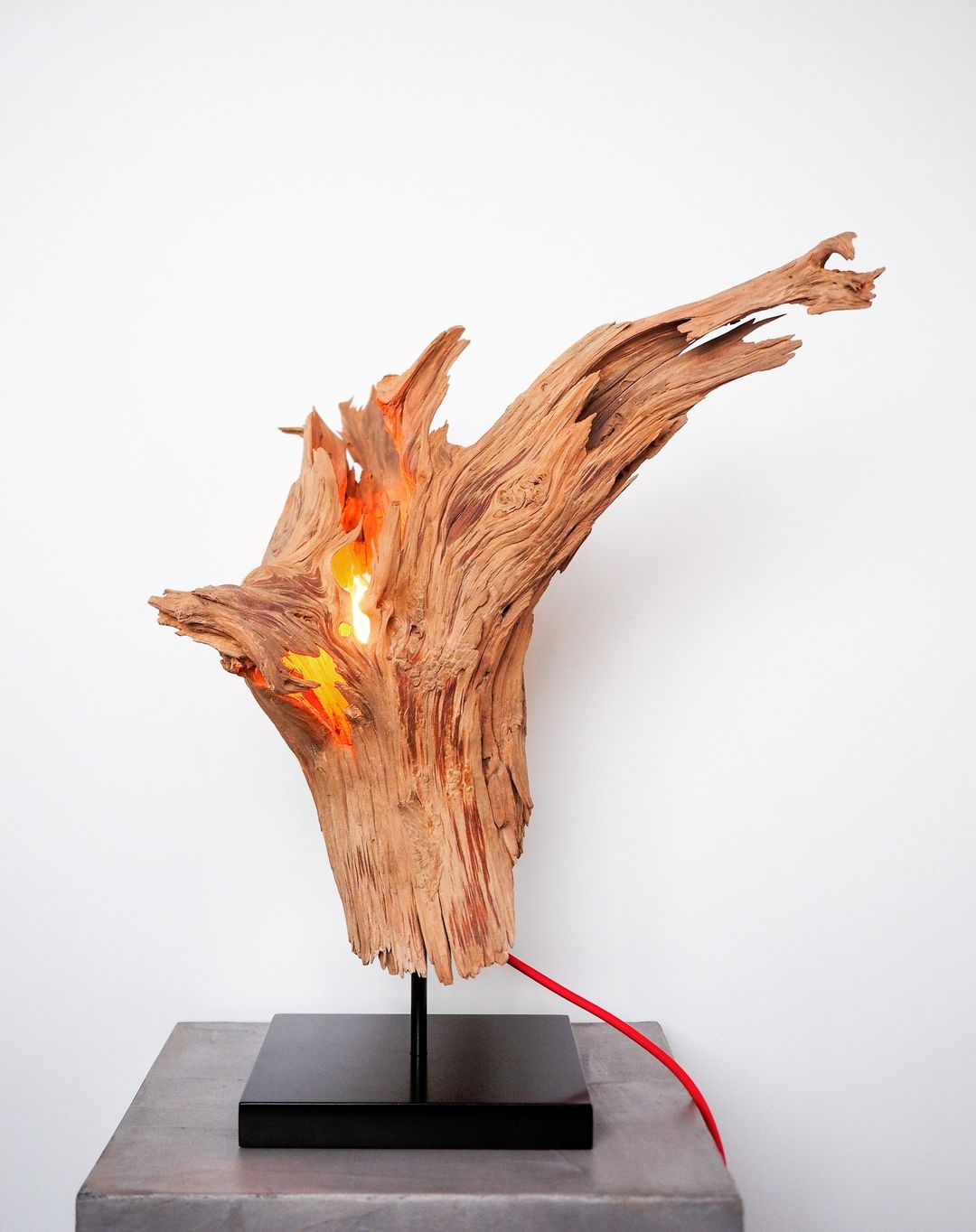 A unique wood sculpture resembling flames