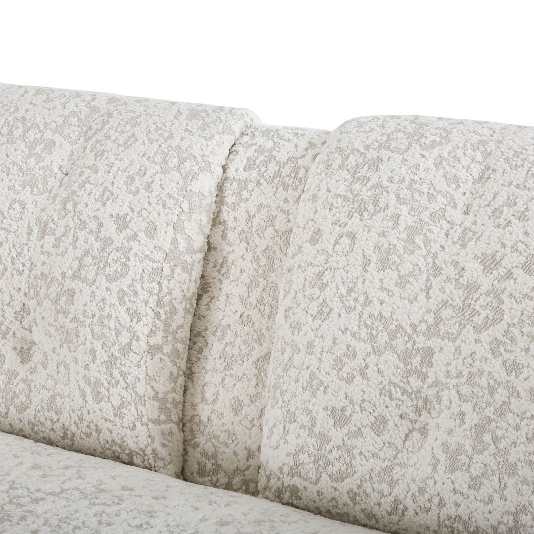 A close-up view of sofa cushions with a textured pattern