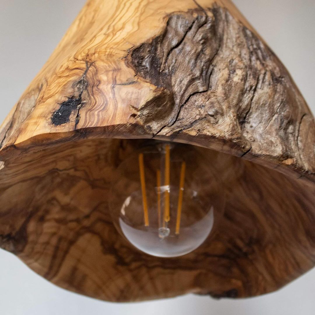 A unique wooden pendant lamp highlighting the natural wood grain and texture