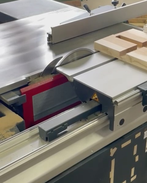 A table saw with safety features and precision cutting capabilities for woodworking.