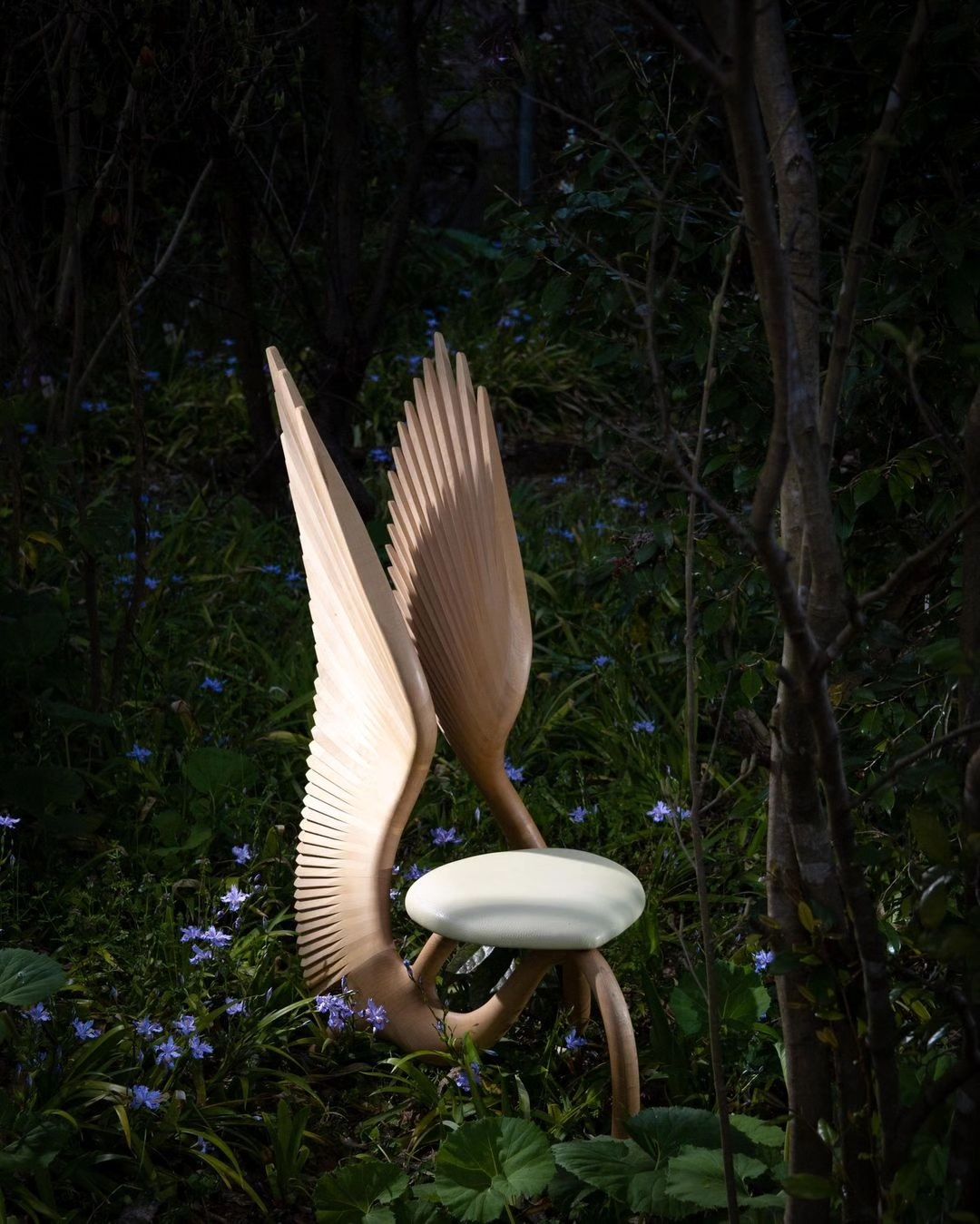 Artistic Wooden Bird Lamp in a Garden