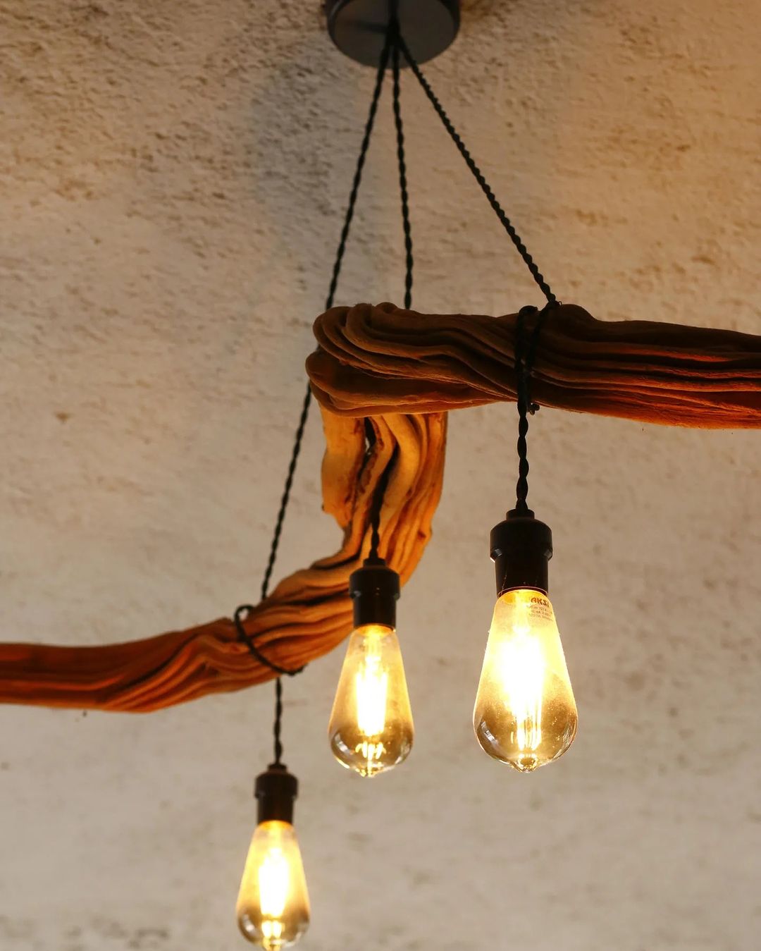 A rustic yet modern lighting fixture