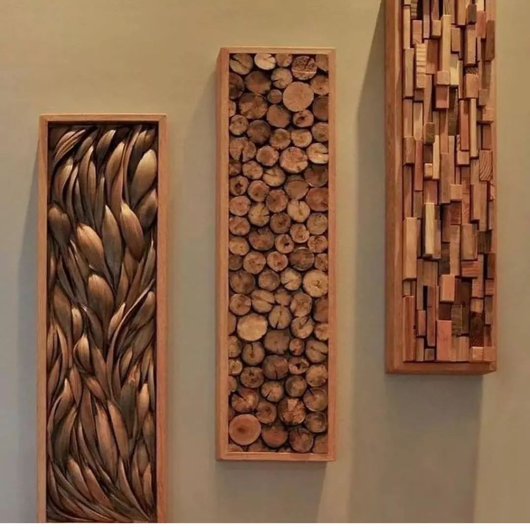 Three wooden wall art pieces