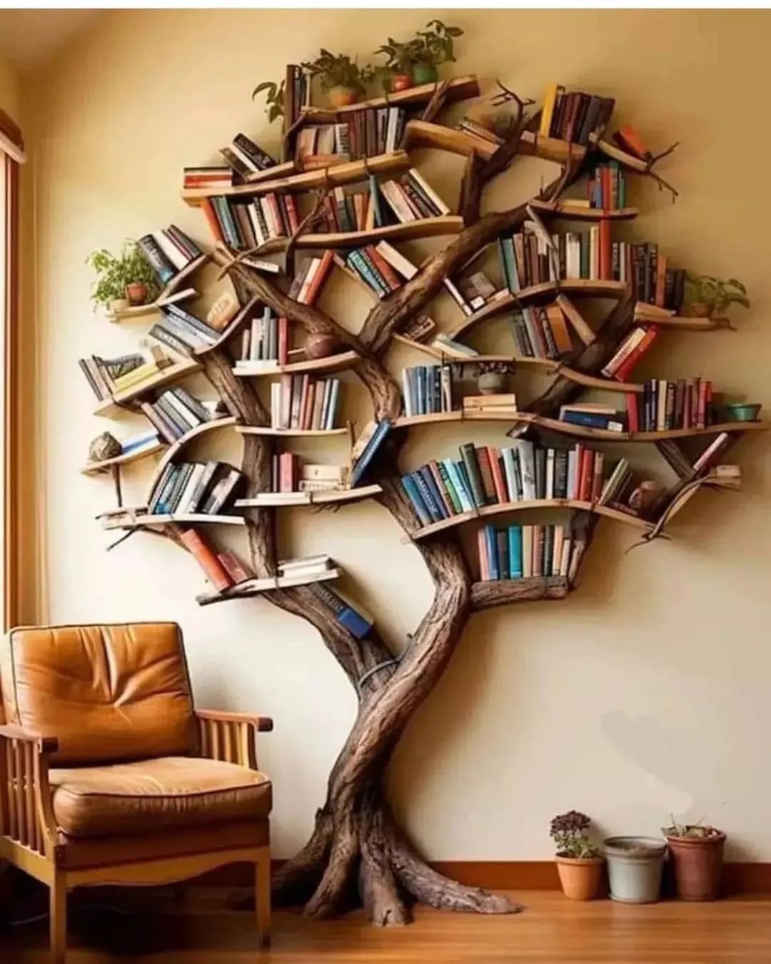 A unique bookshelf in the shape of a tree with branches filled with a variety of books