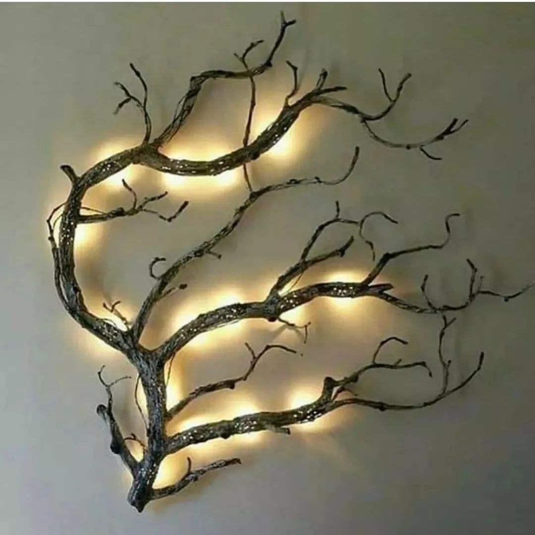 A unique wall-mounted lighting feature that mimics the organic form of tree branches