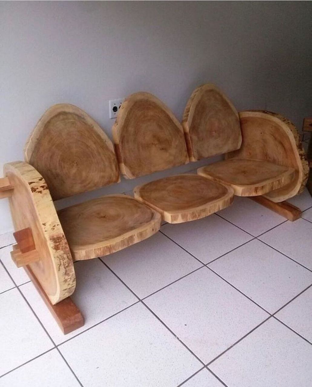 A set of wooden chairs crafted from cross sections of logs