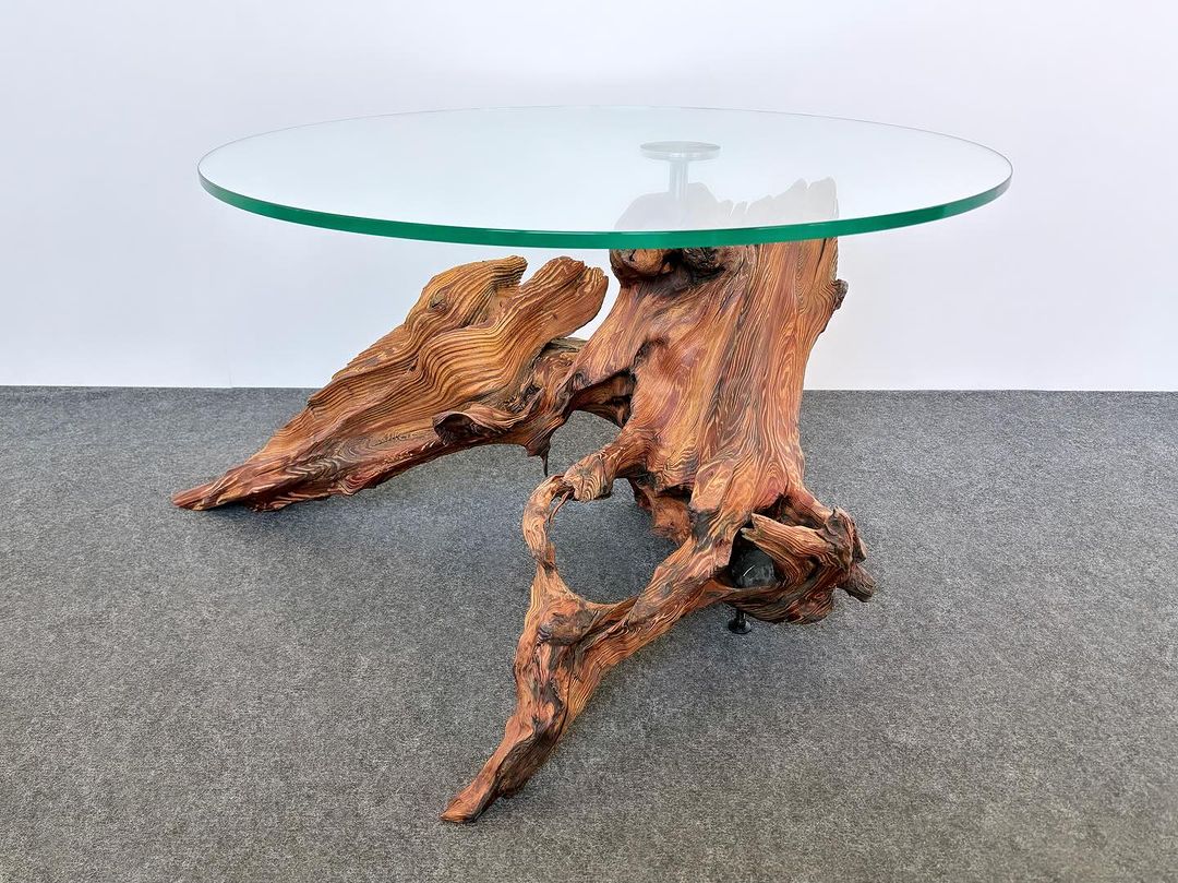 Unique wood and glass table with intricate base