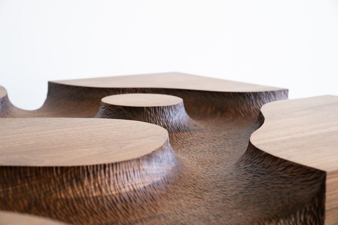 Unique undulating wooden table design