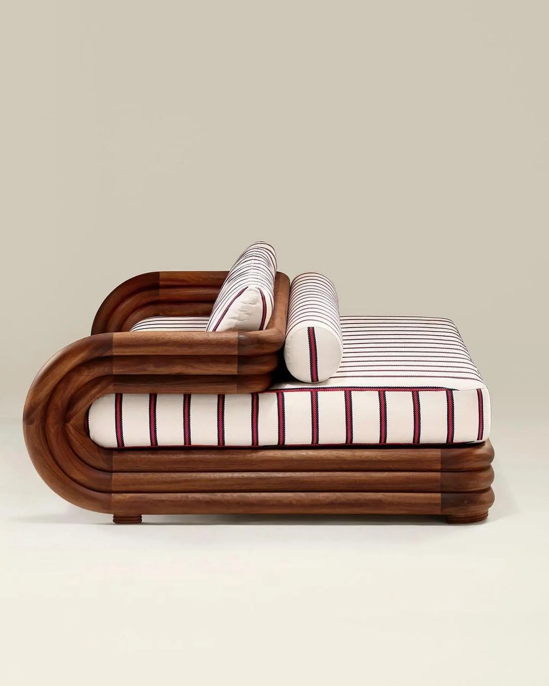 Unique wooden bed design with layered frame and striped bedding