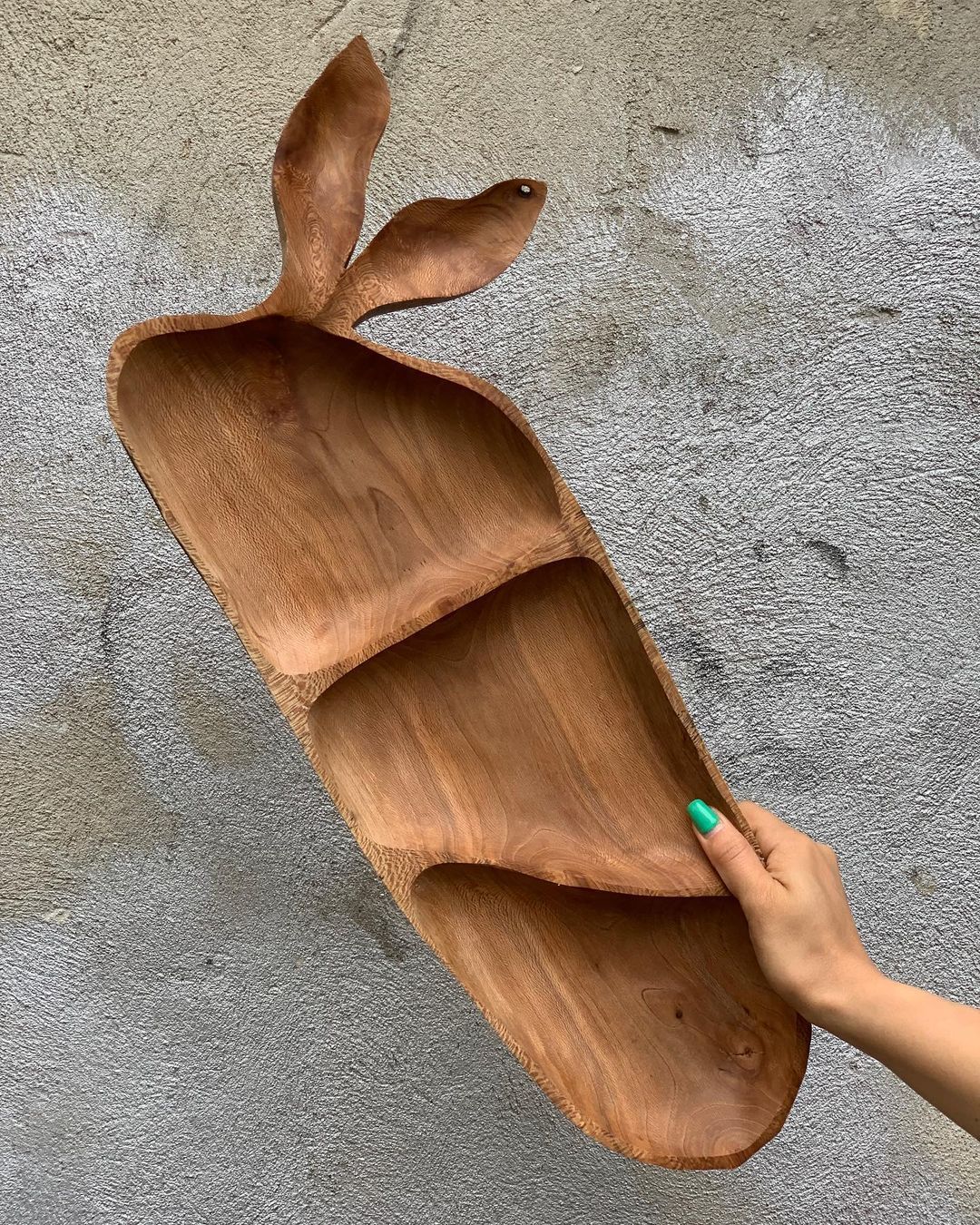 Unique wooden fruit bowl in the shape of a cacao pod