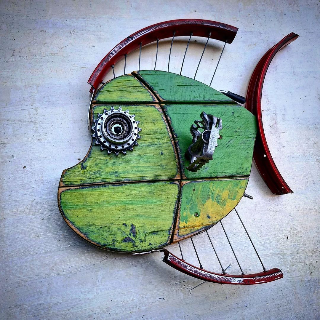 A whimsically crafted fish sculpture made from upcycled materials