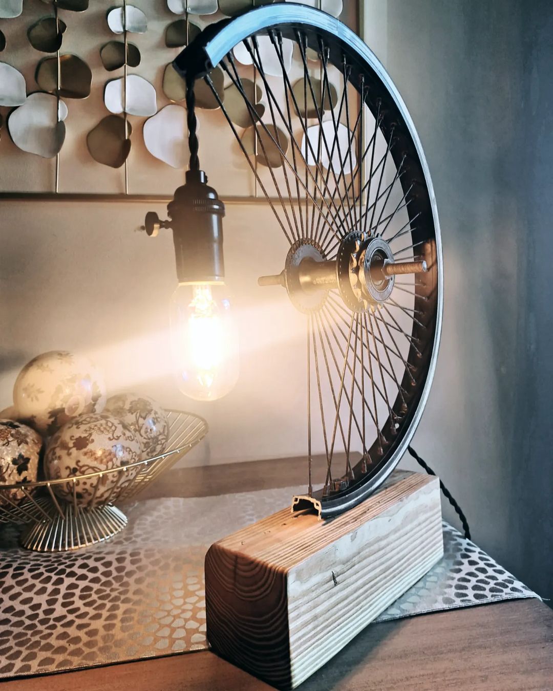 A transformed bicycle wheel into a stylish lamp