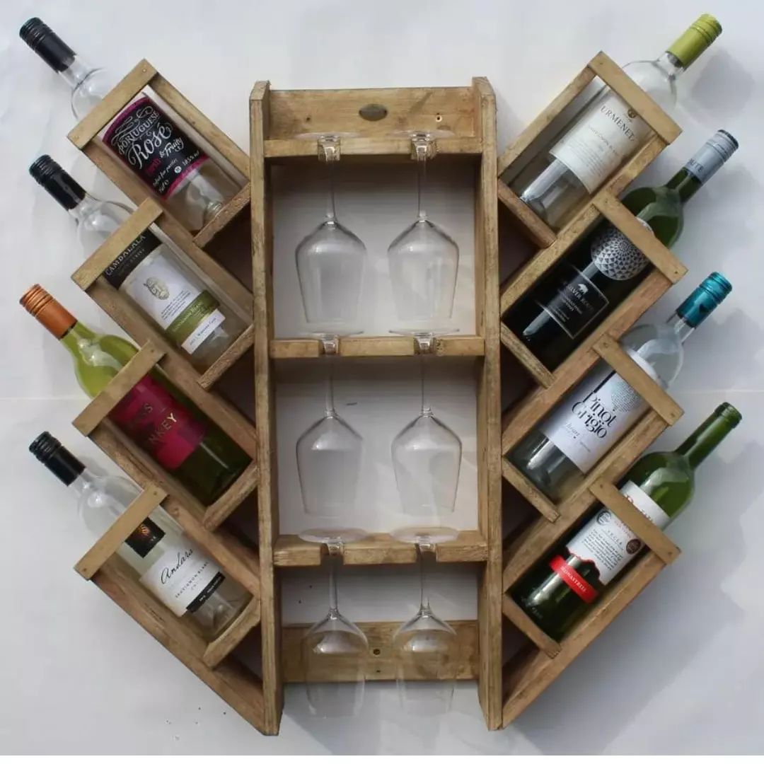 A well-organized wooden wine rack with spaces for bottles and hanging glasses.