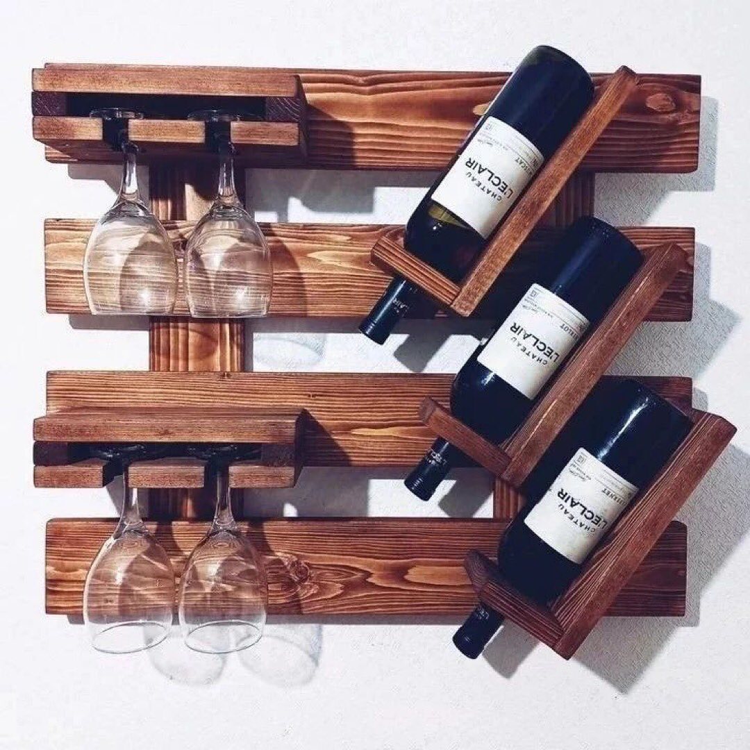 A stylish and functional wall-mounted wine rack with a glass holder