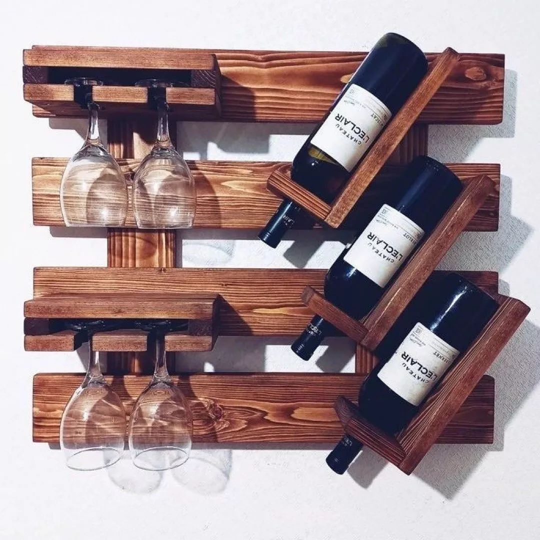 A modern wall-mounted wooden wine rack holding bottles and glasses