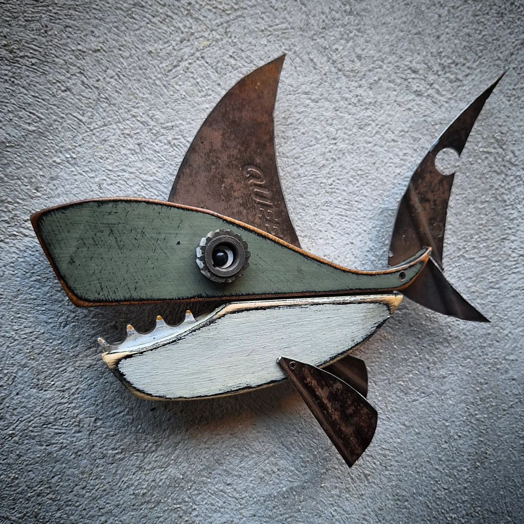 A whimsical wall-mounted fish sculpture