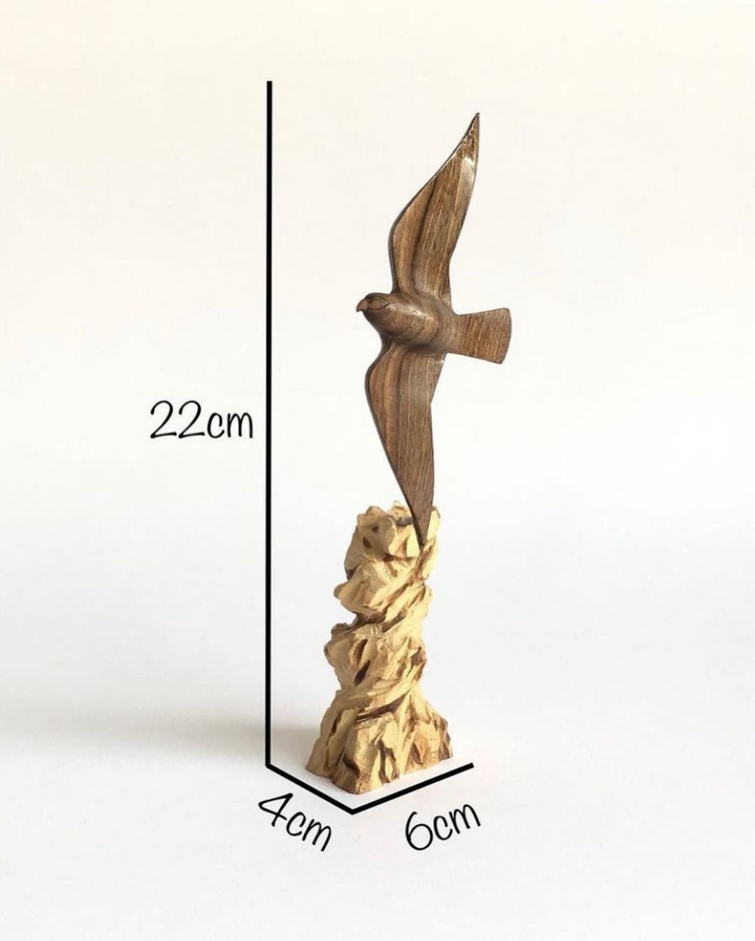 Artistic Wood Carving of a Bird in Flight