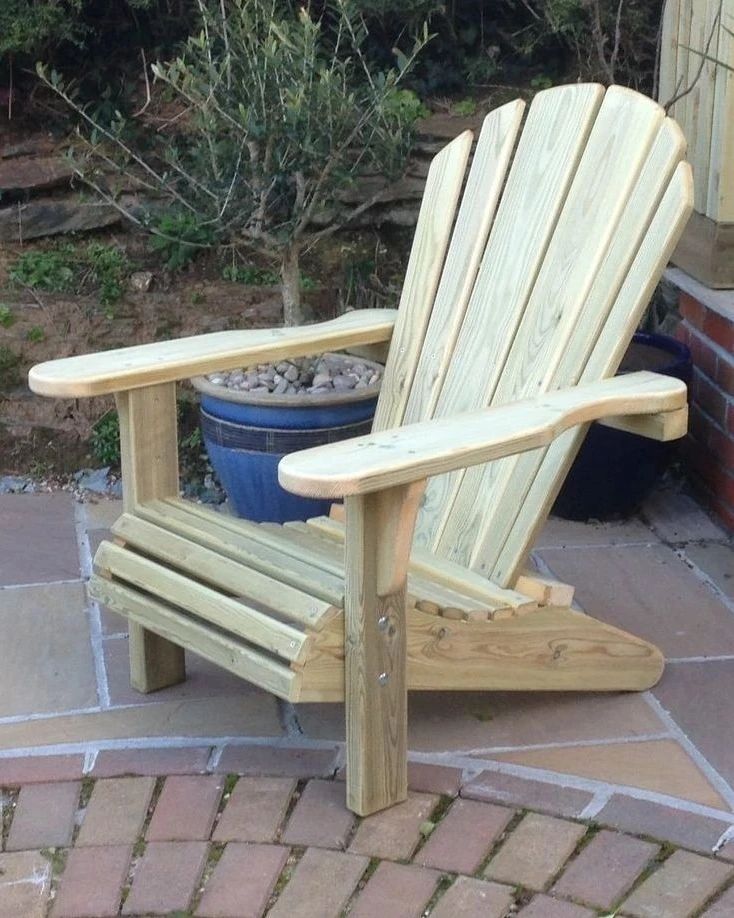 Classic wooden Adirondack chair on a brick patio